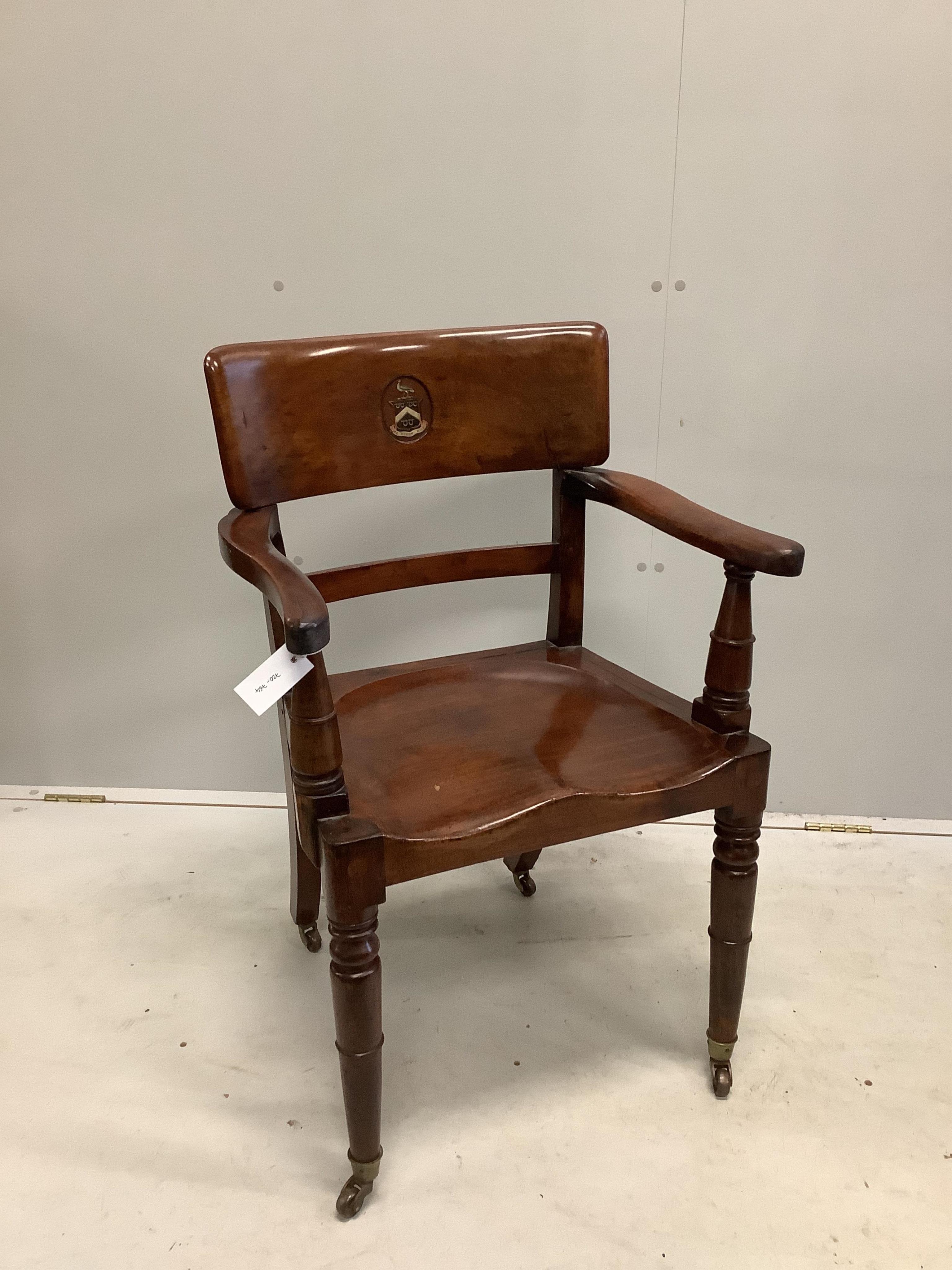 An early 19th century mahogany hall chair with painted armorial and motto 'We Stoop Not', with a Victorian beadwork cushion, width 56cm, depth 42cm, height 88cm. Condition - good